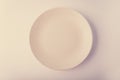 Top view of a pastel plate on a pastel peach background. Minimalism food photography. Geometric style. Royalty Free Stock Photo