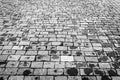 Top view on paving wet stone road after rain. Old pavement of granite texture. Street cobblestone sidewalk Royalty Free Stock Photo
