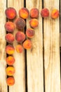Top view on peaches, on wood