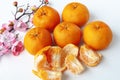 Top view of Pealed Mandarin oranges on white cover background. Chinese New Year celebration