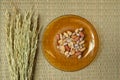 Top view,Peanut in plate on the bamboo mats background