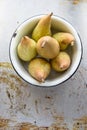 Top view: pears in bowl. Rustic vintage style Royalty Free Stock Photo