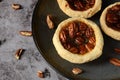 Top view pecan butter tarts with nuts