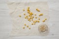 Top view, peeled chickpeas for hummus. Flat lay, overhead, from above. White wooden background
