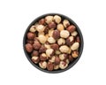 Top view of peeled hazelnuts in a black bowl isolated on white background Royalty Free Stock Photo