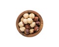 Top view of peeled hazelnuts in a wood bowl isolated on white background Royalty Free Stock Photo