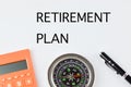 Top view of pen, compass and calculator with text RETIREMENT PLAN Royalty Free Stock Photo