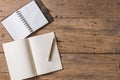 Top view of Pen, notebook, glasses, calculator, smartphone on wooden table and copy space