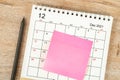 Top view of pencil, calendar planning and deadline with sticky note on wooden background, Calendar desk 2021 on December month Royalty Free Stock Photo