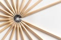 Top view of pencils made of wood lie on a white surface forming an open circle