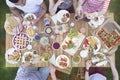 Top view on people eating food during grill party in the garden Royalty Free Stock Photo