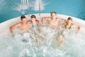 Top view - people relax in hot tub