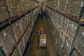 Top view of people standing in megastore with lots of containers on the shelves