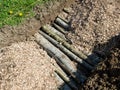 Top view of permaculture trench with wood logs and shredded wood