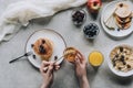 top view of person eating delicious homemade pancakes with honey and fruits Royalty Free Stock Photo