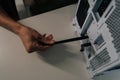 Top view of person hand installing wireless network adapter antenna into personal computer, providing faster internet Royalty Free Stock Photo