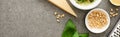 Top view of pesto sauce raw ingredients, grater on grey surface, panoramic shot Royalty Free Stock Photo