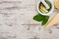 Top view of pesto sauce raw ingredients in pounder on wooden weathered table Royalty Free Stock Photo