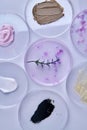 Top view petri dishes with various cream samples.