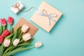 Top view photo of a photo album, envelope, tulips and gift boxes Royalty Free Stock Photo