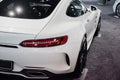 Top view. Photo of the back of modern white colored beautiful car parked indoors