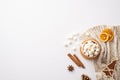 Top view photo of cup of hot cocoa with marshmallow on rattan placemat knitted plaid fir wooden ornament dried orange slices pine Royalty Free Stock Photo