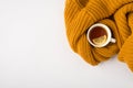 Top view photo of cup of tea with lemon slice and yellow sweater on isolated white background with empty spaceTop view photo of Royalty Free Stock Photo