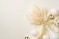 Top view photo of easter decorations white vase with bouquet of lagurus flowers ceramic easter bunny eggs and textile on isolated Royalty Free Stock Photo