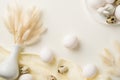 Top view photo of easter decorations white vase with lagurus flowers plate ceramic bunny easter eggs and linen on isolated white Royalty Free Stock Photo