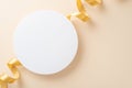 Top view photo of empty white round space with a beige ribbon on isolated light beige background Royalty Free Stock Photo