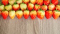 Top view photo, a heap of fresh berry fruit, red strawberry on wooden background with coppy space Royalty Free Stock Photo