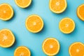Top view photo of juicy orange slices and water drops on isolated light blue background Royalty Free Stock Photo