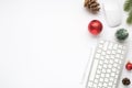 Top view photo of keyboard computer mouse pen red christmas tree balls fir toy twig pine cone on isolated white background with