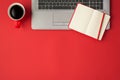 Top view photo of laptop open red reminder pencil and cup of coffee on isolated red background with empty space Royalty Free Stock Photo