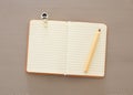 Top view photo of open empty notebook over wooden background. Royalty Free Stock Photo