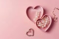 Top view photo of a pink heart-shaped jewelry box with a pearl necklace, earrings Royalty Free Stock Photo