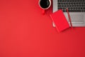 Top view photo of red closed reminder pencil on laptop and cup of coffee on isolated red background with copyspace Royalty Free Stock Photo