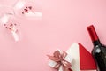 Top view photo of saint valentine`s day decor wineglasses with heart shaped confetti white giftbox with pink bow red envelope car Royalty Free Stock Photo