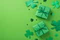 Top view photo of st patrick`s day decorations two green gift boxes with polka dot pattern clover shaped confetti and trefoils on Royalty Free Stock Photo