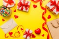 top view photo of st valentine day decor shopping, bag, envelope, gift, box, candy and red heart on colored background Royalty Free Stock Photo