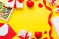 top view photo of st valentine day decor shopping, bag, envelope, gift, box, candy and red heart on colored background Royalty Free Stock Photo