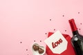 Top view photo of st valentine`s day decor heart shaped saucer with candies confetti red envelope with paper sheet inscription Royalty Free Stock Photo