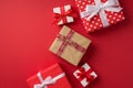 Top view photo of st valentine`s day decorations presents craft paper gift box with ribbon and twine bow on isolated red Royalty Free Stock Photo