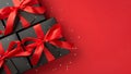 Top view photo of stylish giftbox in black packaging with vivid red satin ribbon bow and tag on isolated black background with Royalty Free Stock Photo