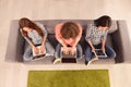 Top view photo of three girls working on laptop and digital tablet Royalty Free Stock Photo