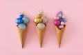 Top view photo of three ice cream cone with Christmas tree balls and sequins Royalty Free Stock Photo