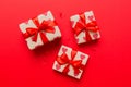 Top view photo of valentine day decorations gift box with red ribbon bow on colored background. Holiday gift boxes with