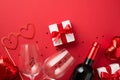 Top view photo of valentine`s day decorations gift box heart shaped paper glasses balloons two wineglasses wine bottle and red