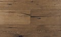 Top view photo of vintage rustic smoked Australian oak wood floor boards with rough texture, brushed and handscraped