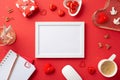Top view photo of white photo frame stationery holders diary computer mouse heart shaped saucer with candies Royalty Free Stock Photo